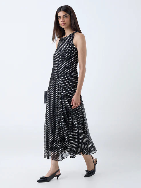 Chic Black Polka Dot Drop-Waist Dress with Feminine Silhouette