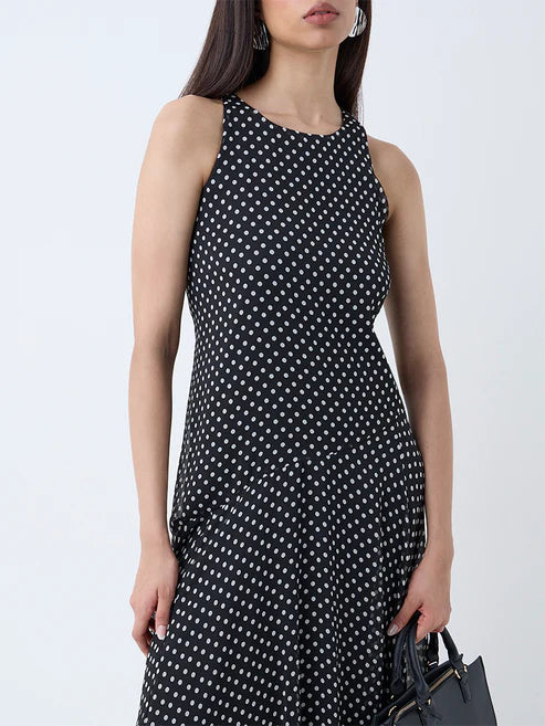 Chic Black Polka Dot Drop-Waist Dress with Feminine Silhouette
