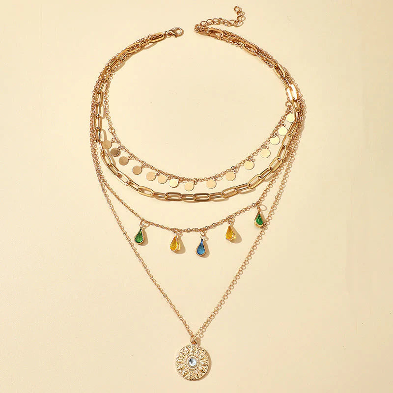 Elegant Layered Artificial Gold Necklace Set Featuring Disc Charms, Chains, and Colorful Teardrop Designs