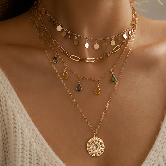 Elegant Layered Artificial Gold Necklace Set Featuring Disc Charms, Chains, and Colorful Teardrop Designs